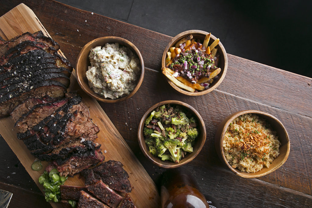 Mighty Quinn's smoked meats include its bestselling beef brisket, pulled pork, brontosaurus rib, sausages, and chicken