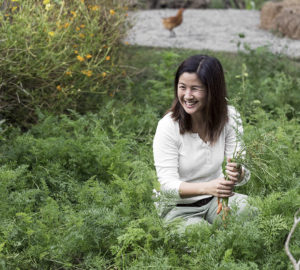 Melanie Go showcasing a portion of the vegetable patches at Holy Carabao Farm