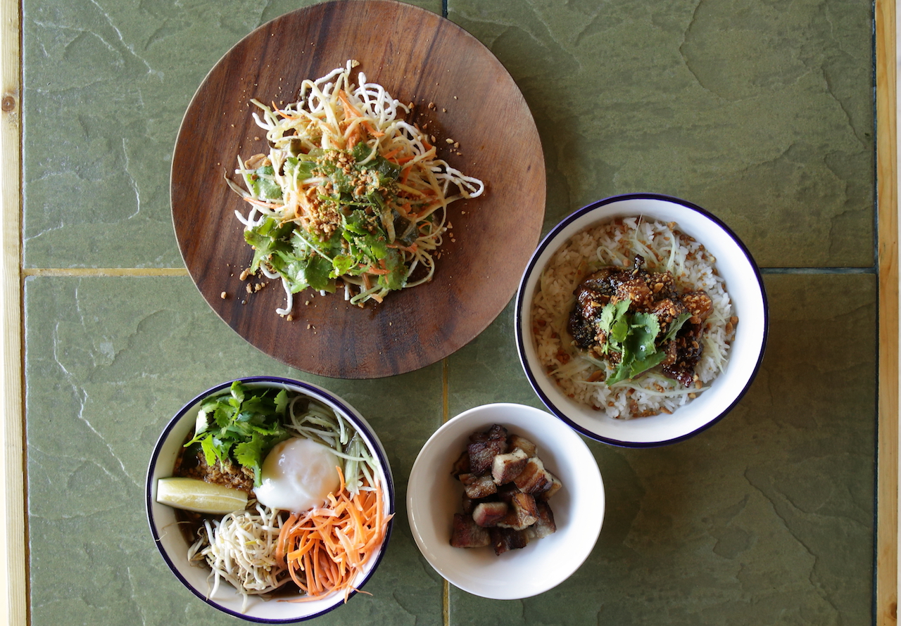 Papa Bear's vegan Thai salad, sambal pork, an order of homecured lemongrass pandan bacon, and What The Pho?