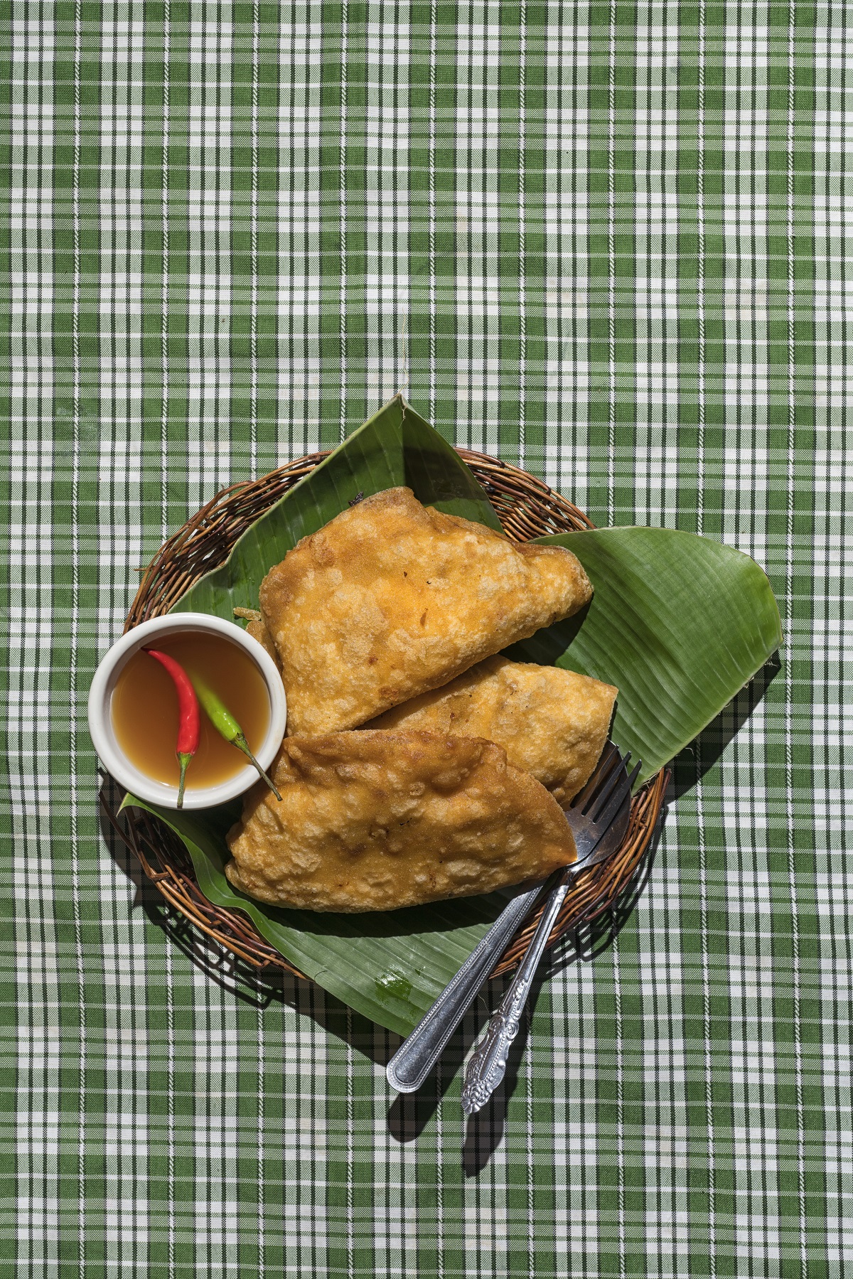 Ilocos empanada is simply rice wrapper filled with various ingredients, then deep-fried in a wok with hot oil