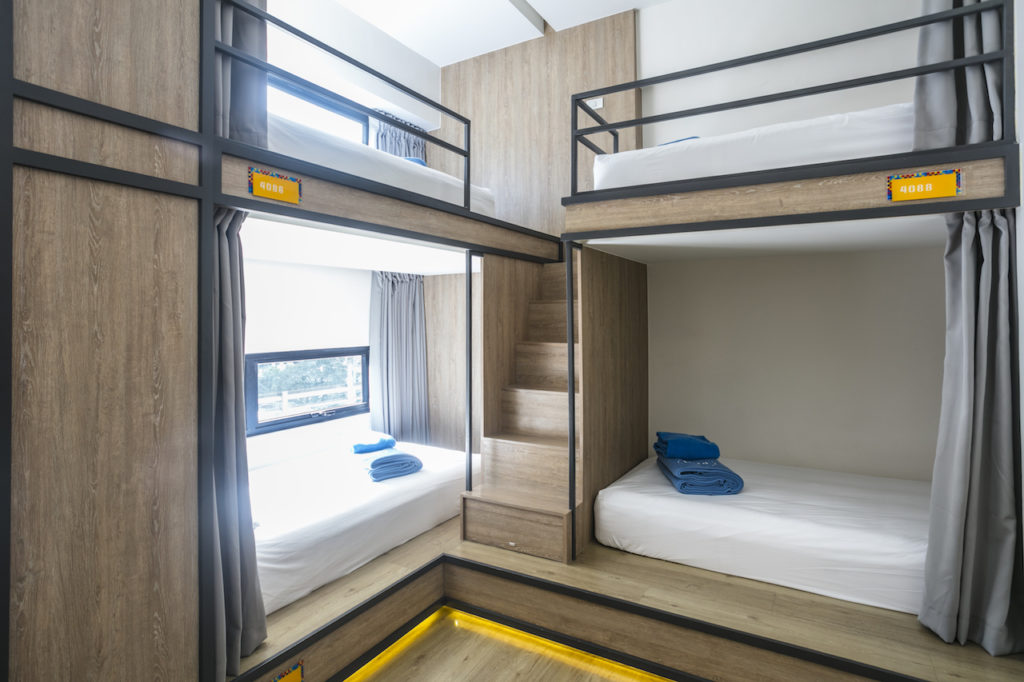 The hostel's shared room still offers privacy per bunk