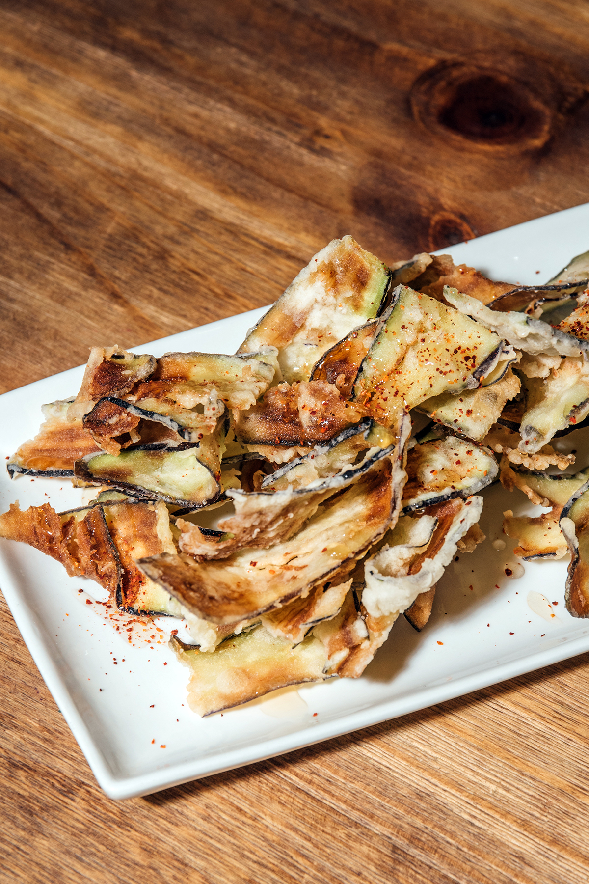 Bar Pintxos' berenjenas fritas (fried eggplant, espelette, honey)