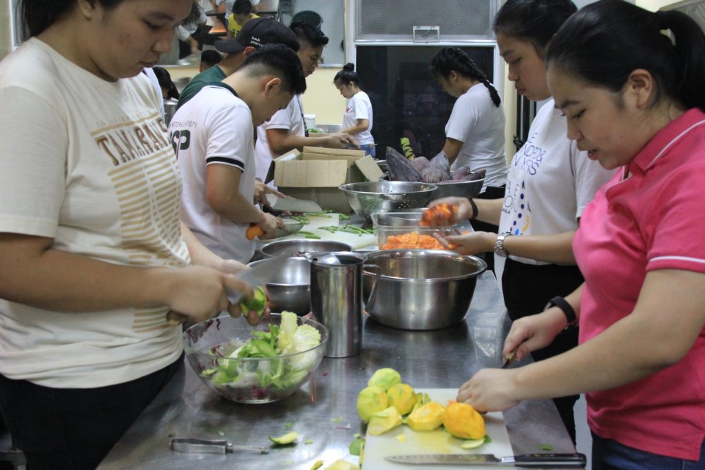 Volunteers assisting in the soup kitchen