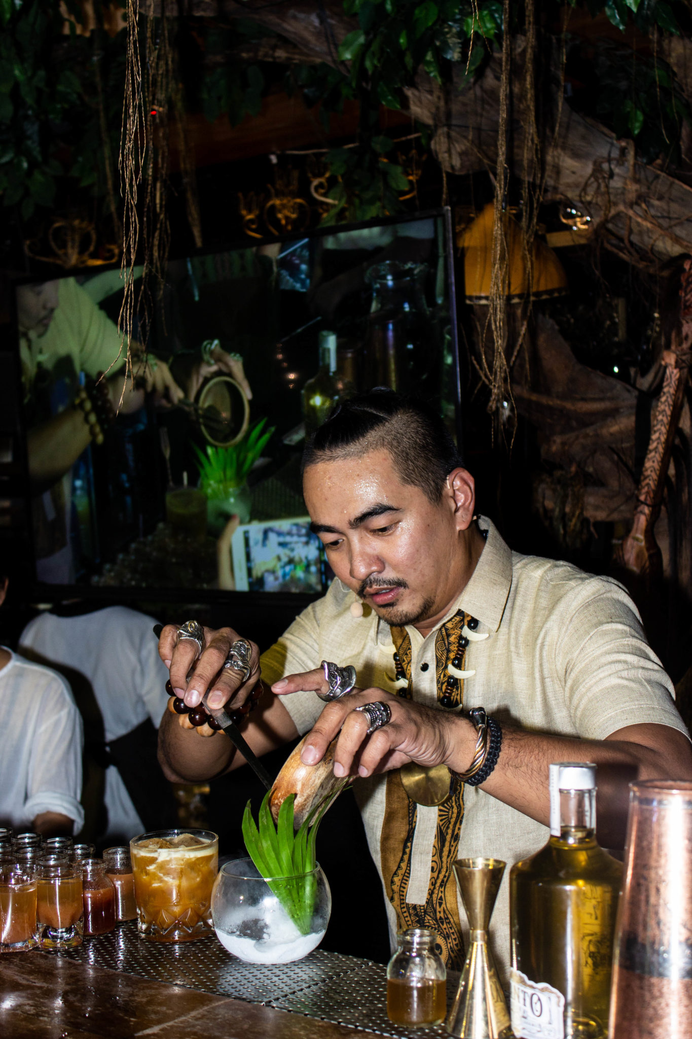 Kalel Demetrio concocting his tea-based liquor