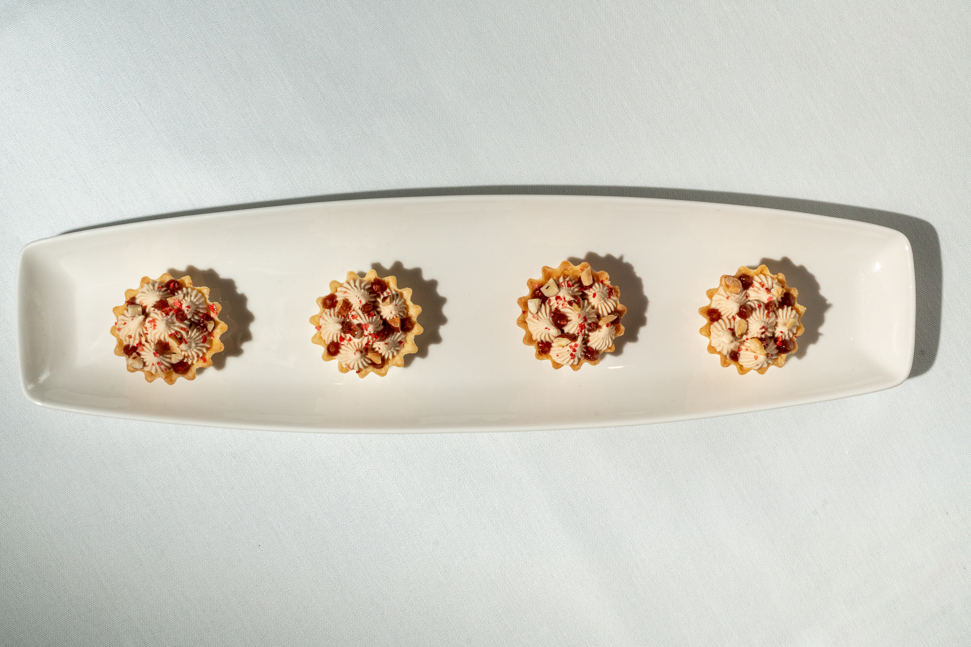 These foie gras tarts showcase the restraint and the discipline of cooking of Miko Calo