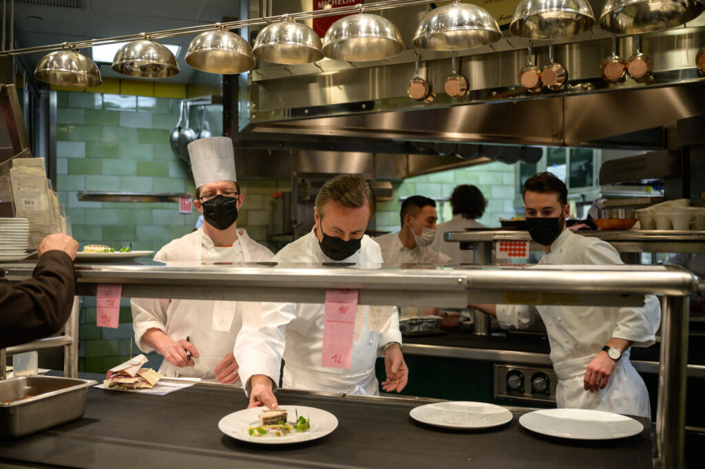 French chef and restaurateur Daniel Boulud works in the kitchen of his restaurant 'Daniel'
