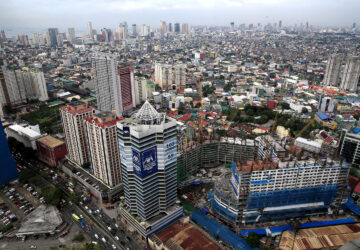 Philippine economic growth: Construction of new buildings alongside older establishments is seen within the business district in Makati City, Metro Manila, Philippines