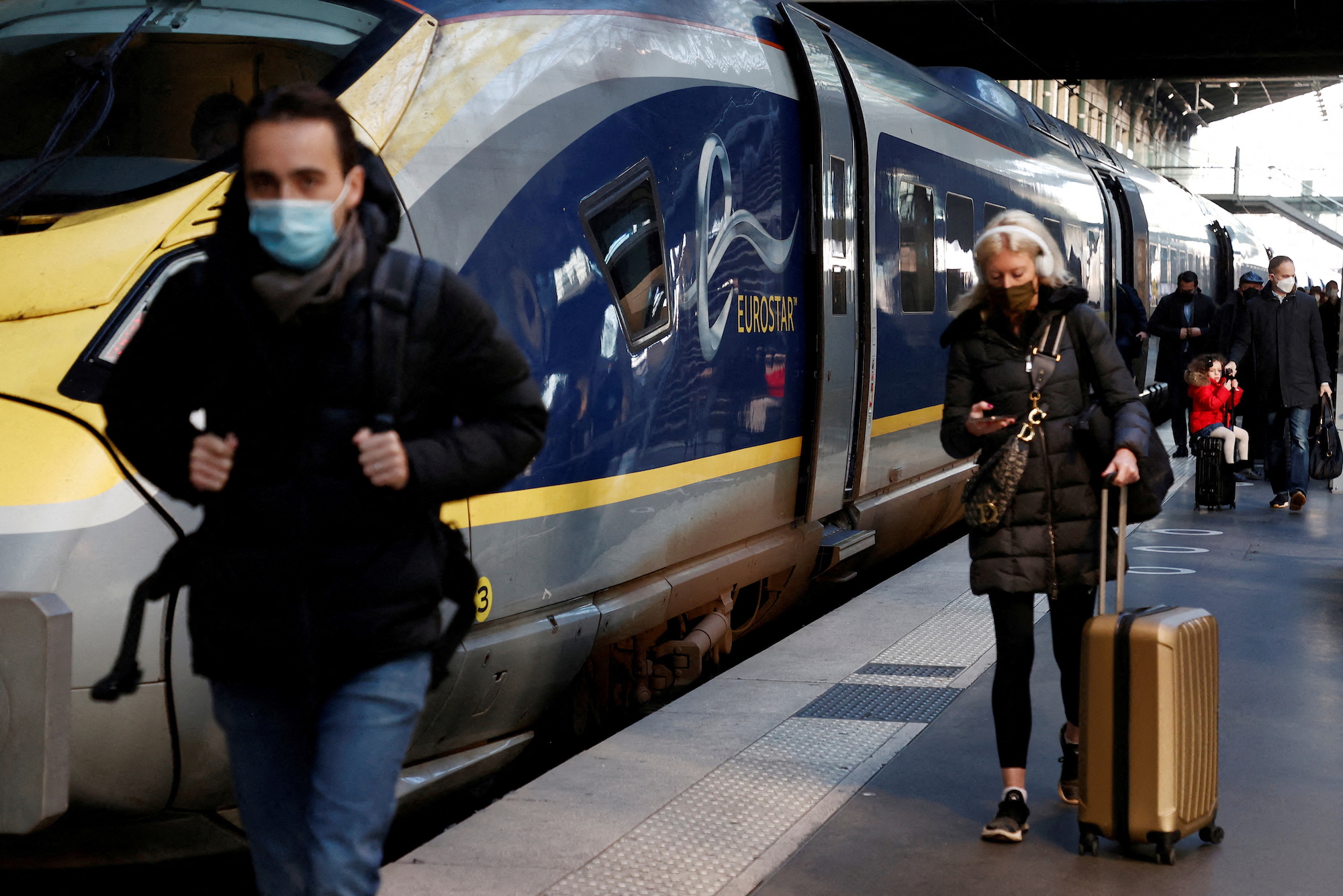 FILE PHOTO: Passengers arrive at the Eurostar terminal at Gare du Nord train station, after France eased travel restrictions for travelers from Britain amid the spread of the coronavirus disease (COVID-19) pandemic