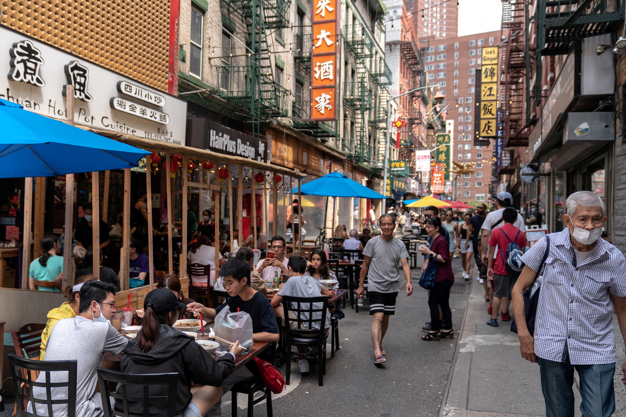 FILE PHOTO: People sit in an outdoor dining area in Manhattan's Chinatown district in New York City