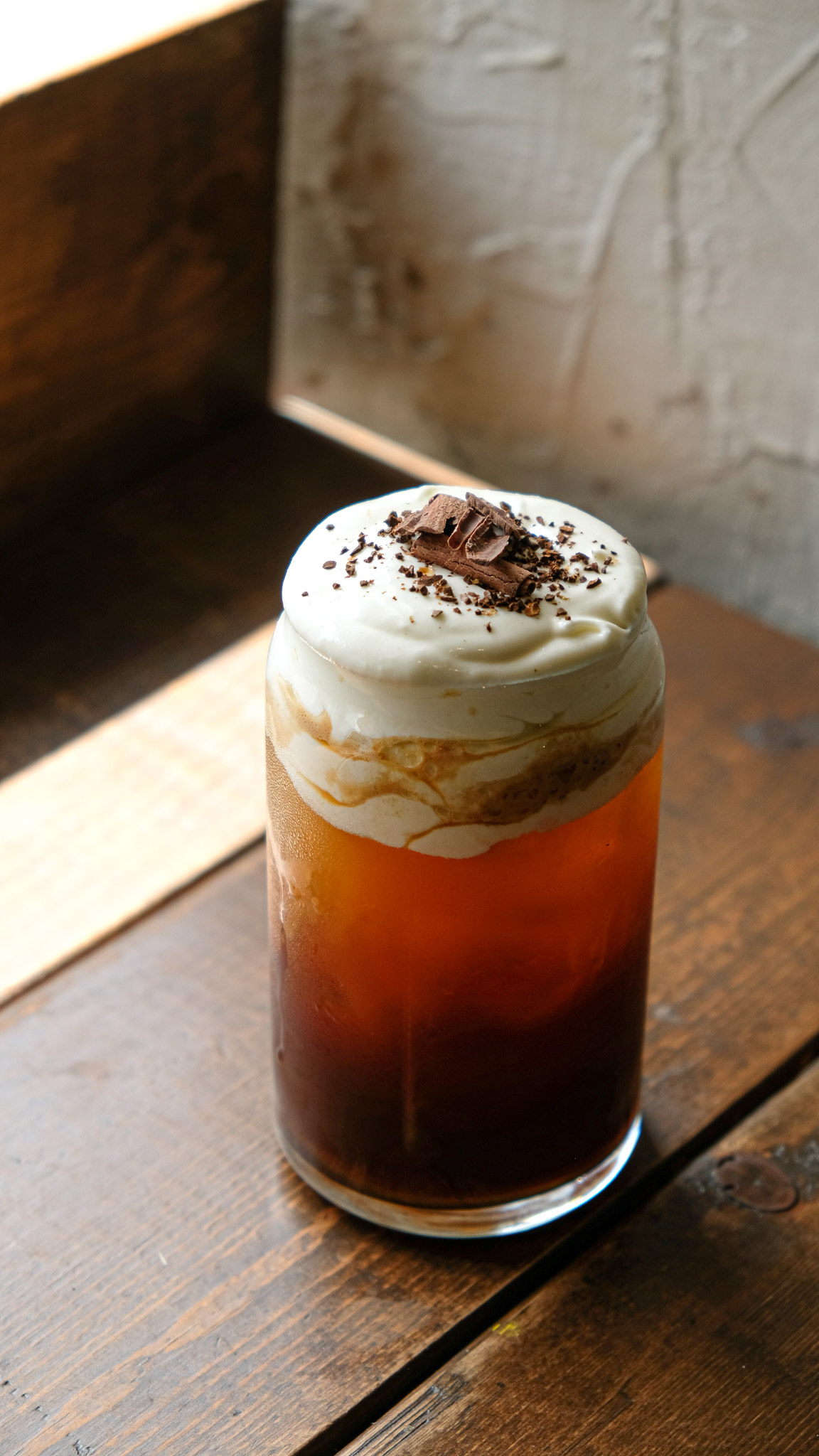 But it's the signature "coffee temptations" that make The Black Bean stand out, like this iced black topped with cream cheese foam called Hey Love!