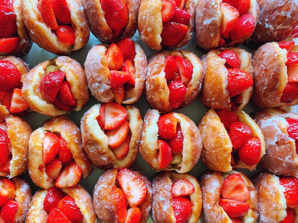 Strawberry-filled glazed doughnuts