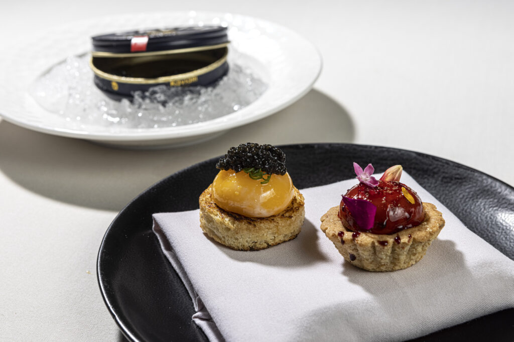 Egg toast (left): Baeri Royal caviar and sourdough brioche; Foie gras mousse: port, apple glaze, whole wheat tartlet