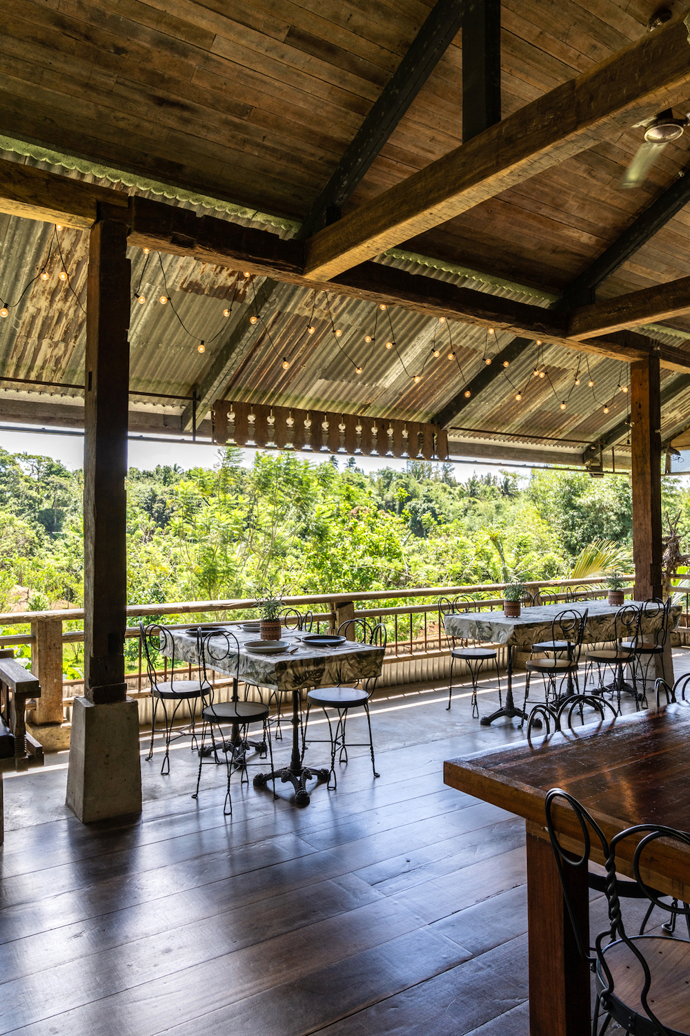 The main dining space of Tuny RestoFarm opens up with serene farm views