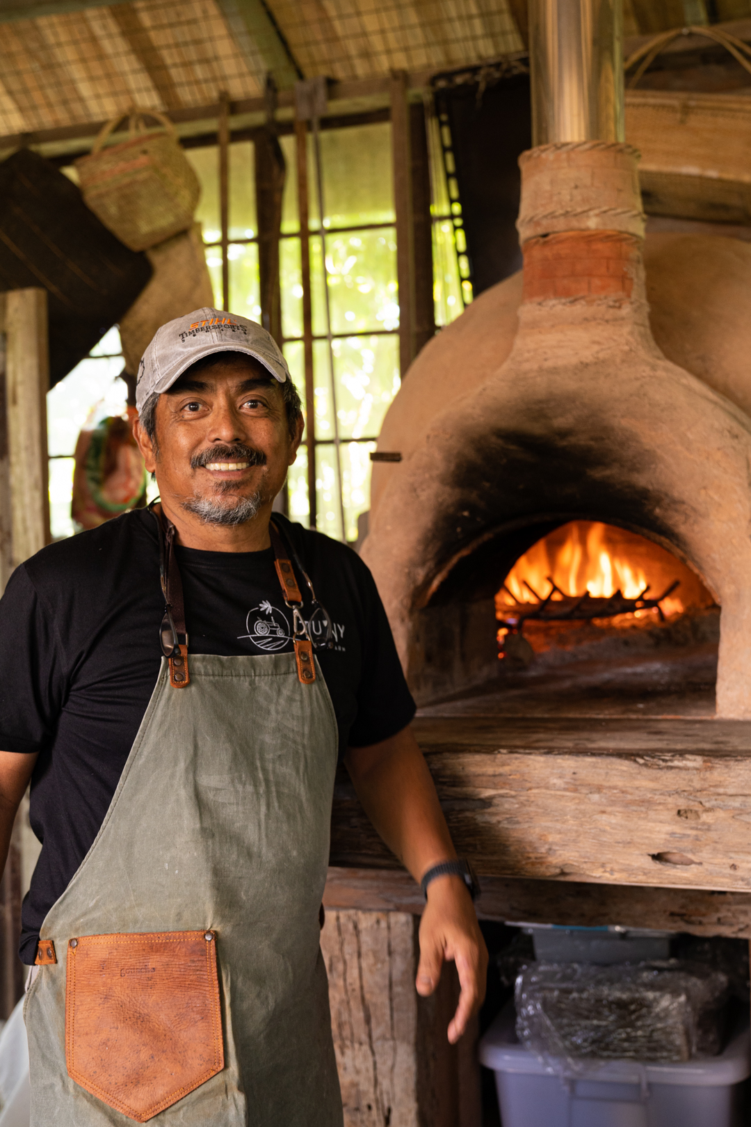 Anthony with his clay wood-fired kiln he himself built