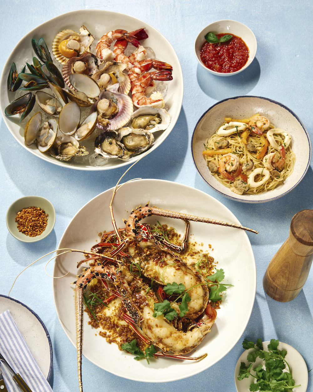 Grilled lobster, seafood cocktail, and seafood cappellini