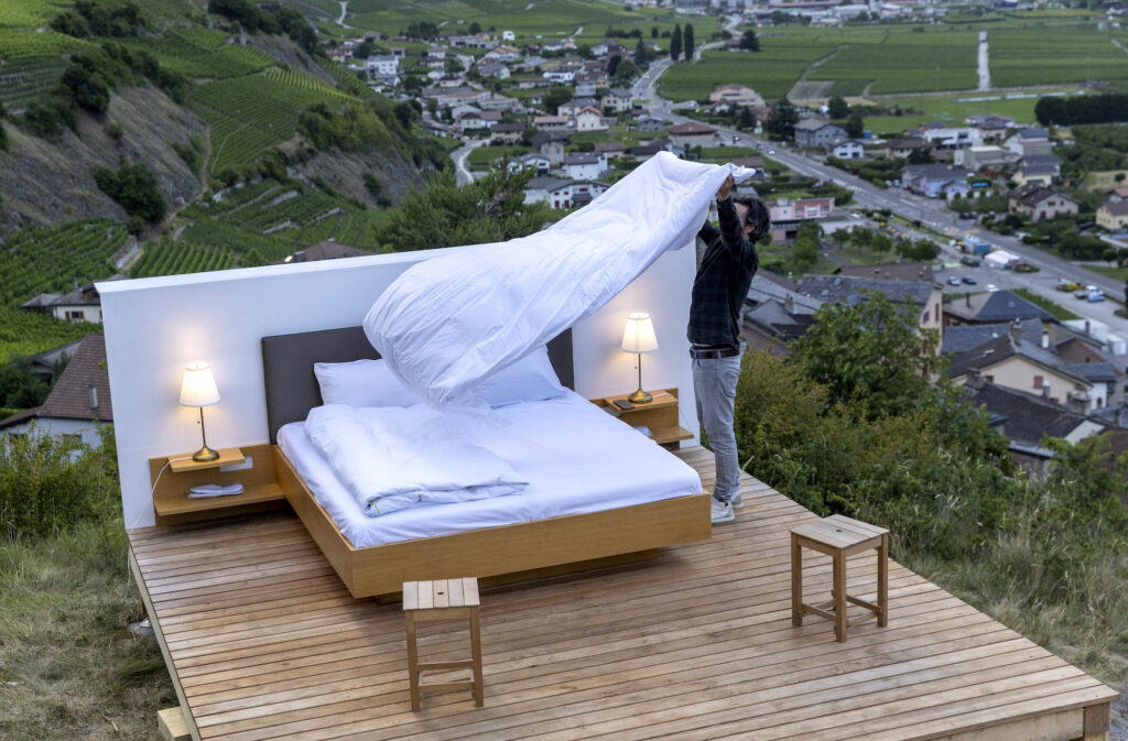 Swiss artist Patrik Riklin, co-founder of the Null-Stern-Hotel (Zero-Star-Hotel) offering guests a choice between four open-air rooms in reaction to the world current state after the pandemic, prepares the Bayart suite in Saillon