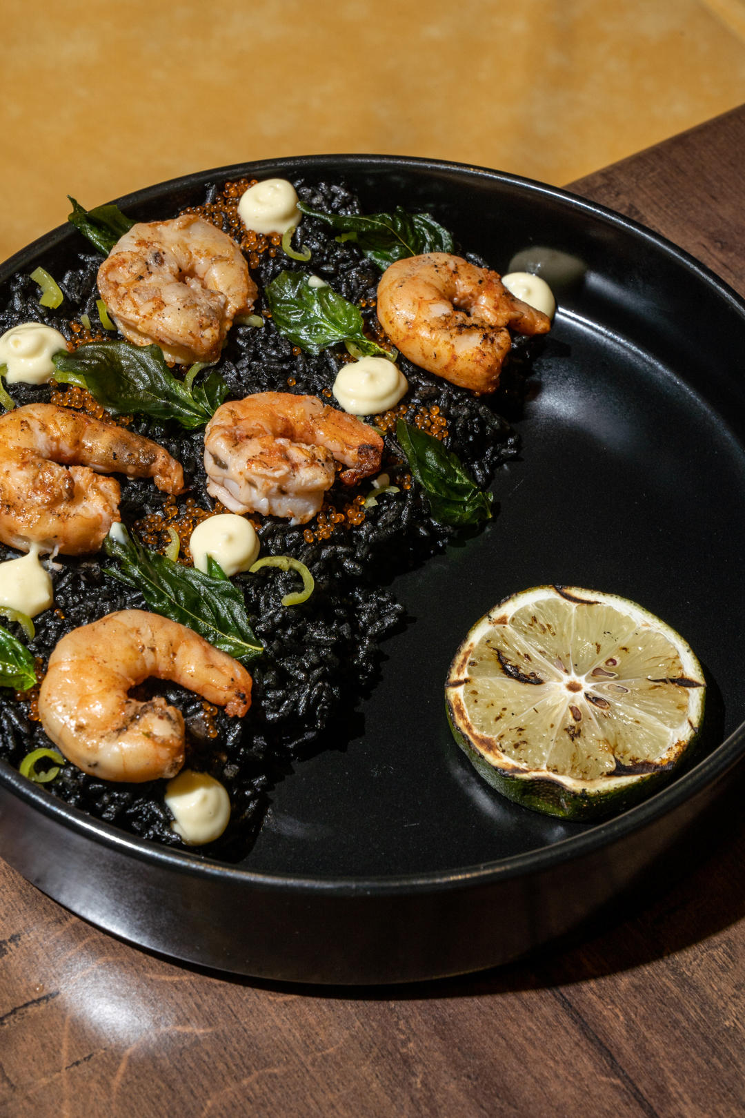 Squid and Shrimp: Black rice, sofrito de calamar, ebiko, and coal-cooked shrimps