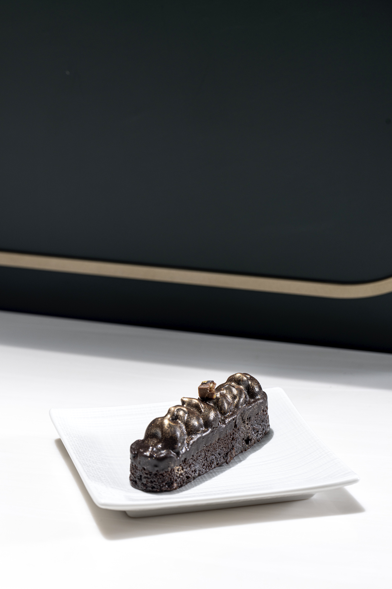 Tablea Nut Brittle is made with tablea chocolate sponge, salted caramel nut brittle, and tablea chocolate cremeux