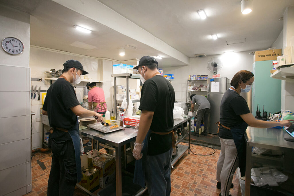 The Taco-Mata kitchen team operating inside the rented bar kitchen