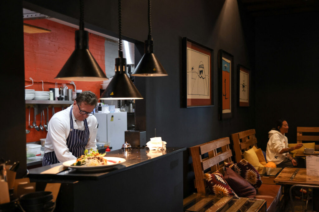 Head chef Sacha De Brunel prepares meals in the kitchen at Bay Ten Espresso in Sydney, Australia