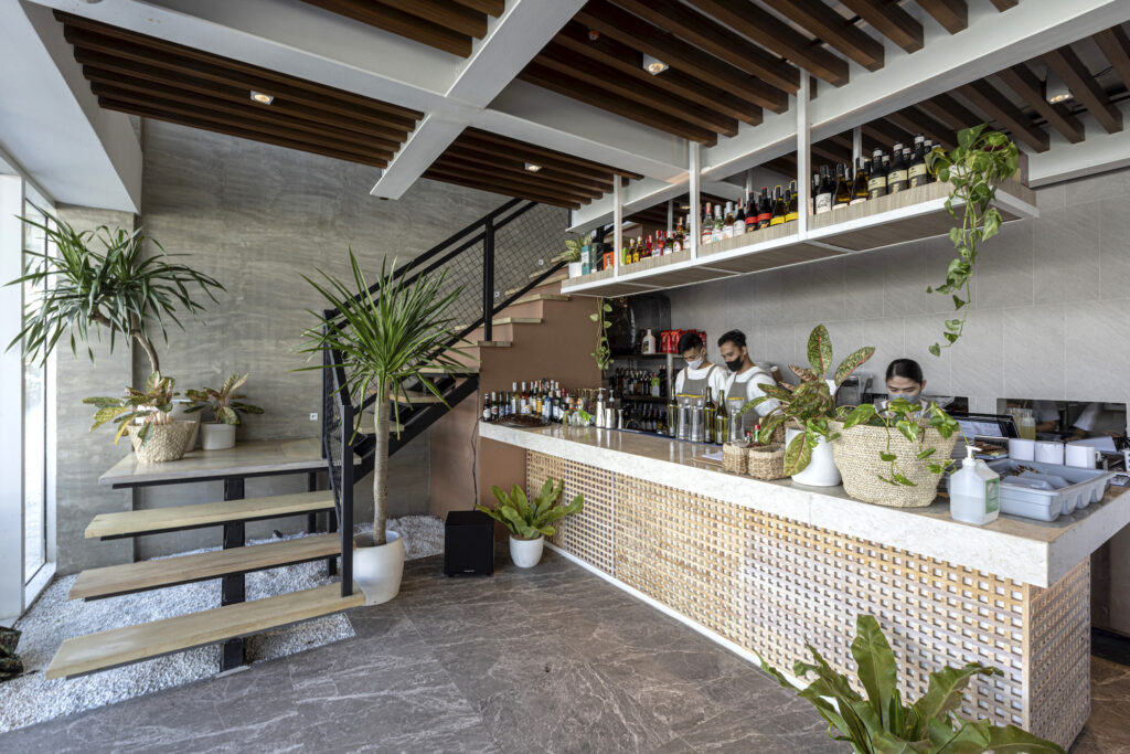 Customers are greeted into the restaurant by a greenery-filled space and open bar/counter at Sobra Cafe, the first restaurant of David Licauco