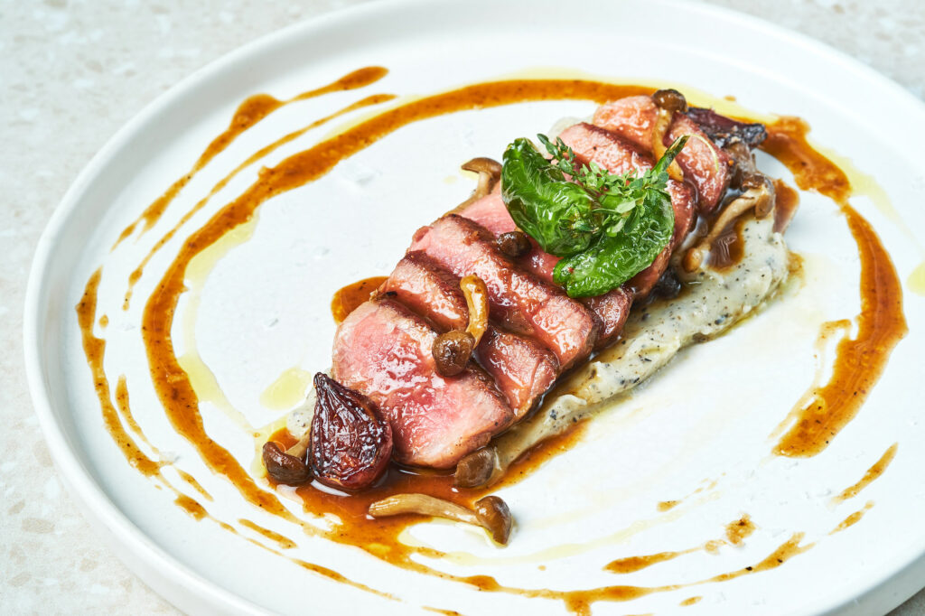 Presa Ibérica de Cerdo (seared Iberico pork Presa, truffle mashed potato, caramelized shallots, and wild mushrooms)