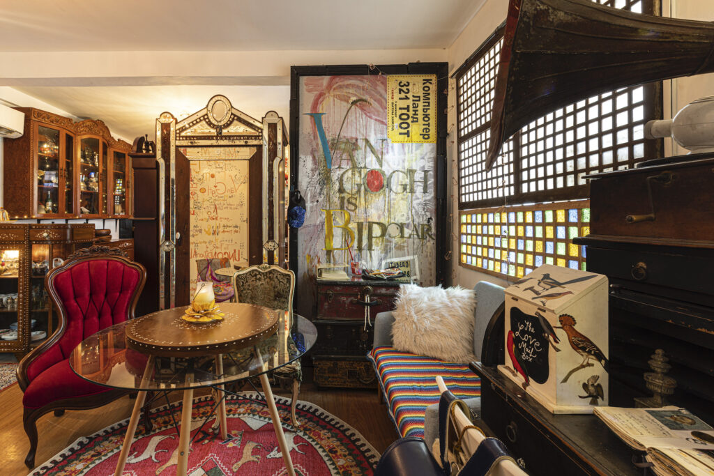 The space is home to a diverse collection of furniture and travel mementos