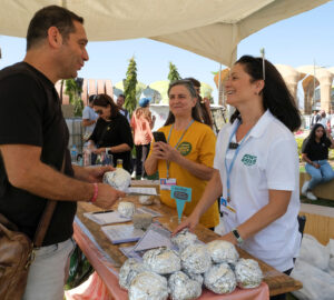 Yael Gabay, The Plant Based Treaty global co-director with a team give away free vegan burgers during COP27 climate summit in Red Sea resort at Sharm el-Sheikh, Egypt