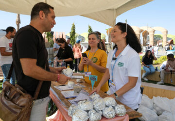 Yael Gabay, The Plant Based Treaty global co-director with a team give away free vegan burgers during COP27 climate summit in Red Sea resort at Sharm el-Sheikh, Egypt