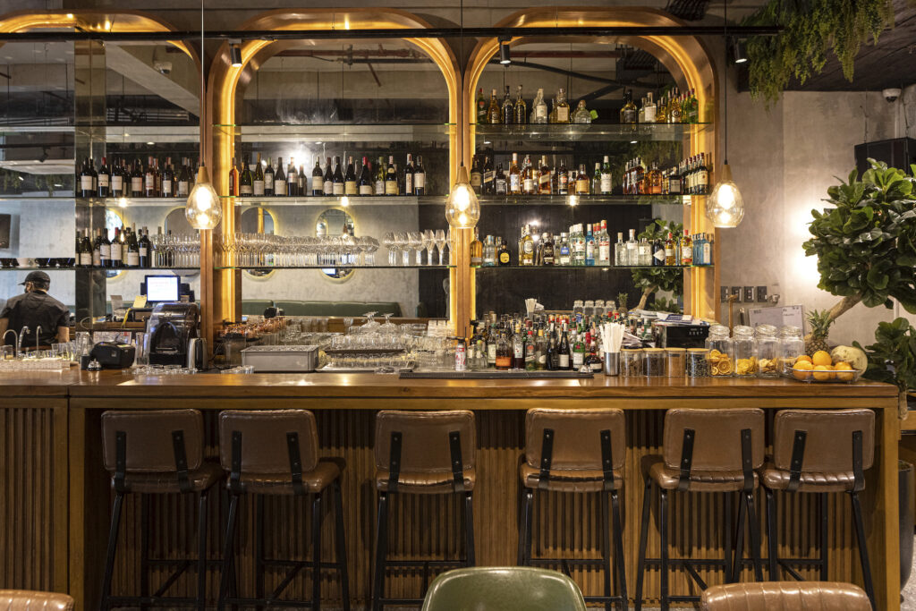 The bar's wooden counter brings a new feeling to drinking