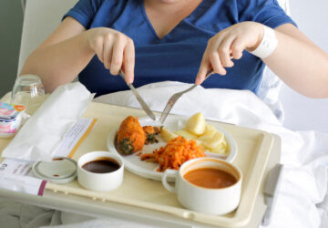 A patient eats her lunch prepared at AZ Groeninge Hospital in Kortrijk, Belgium