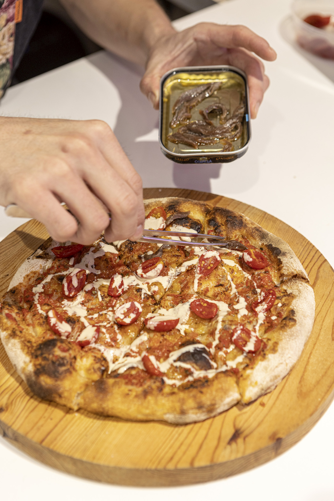 The not-so-secret ingredient to the marinara pizza's power? Cantabrian anchovies, which are renowned for their quality, umami flavor, and storied canning history