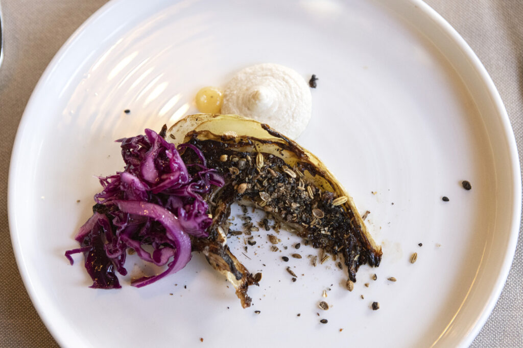 Grilled cabbage with oregano, fennel seeds, and hazelnut butter sauce
