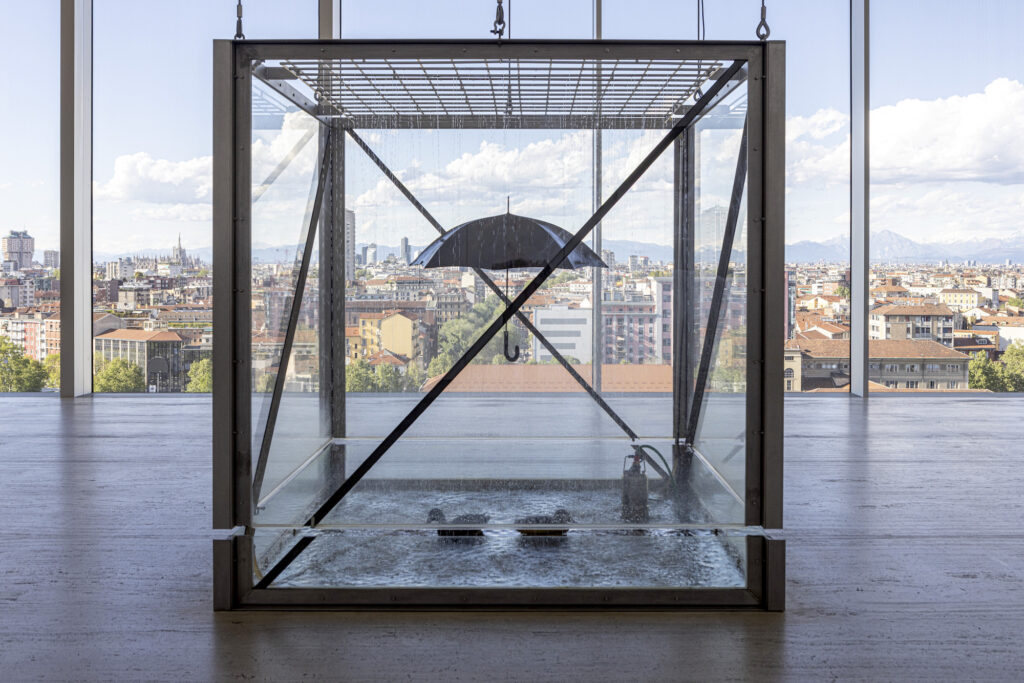 Tears for Everybody’s Looking at You” by Damien Hirst with a panoramic view of Milan
