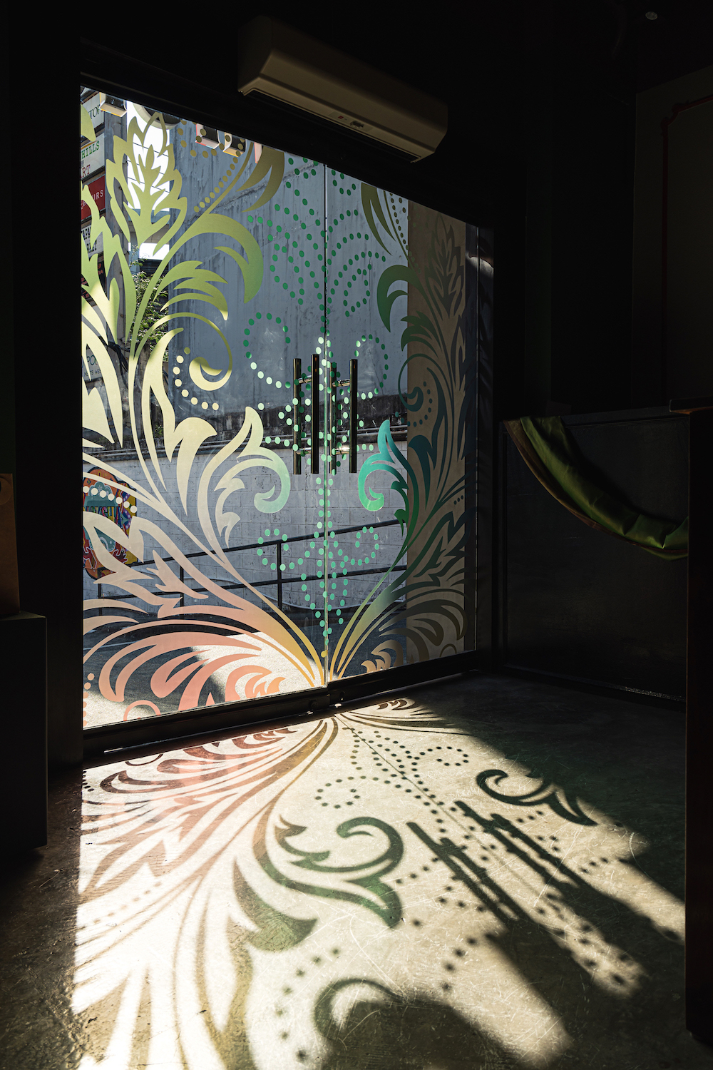 The rangoli design on the glass doors is reflective of the colorful expression customers can expect at Ricksha