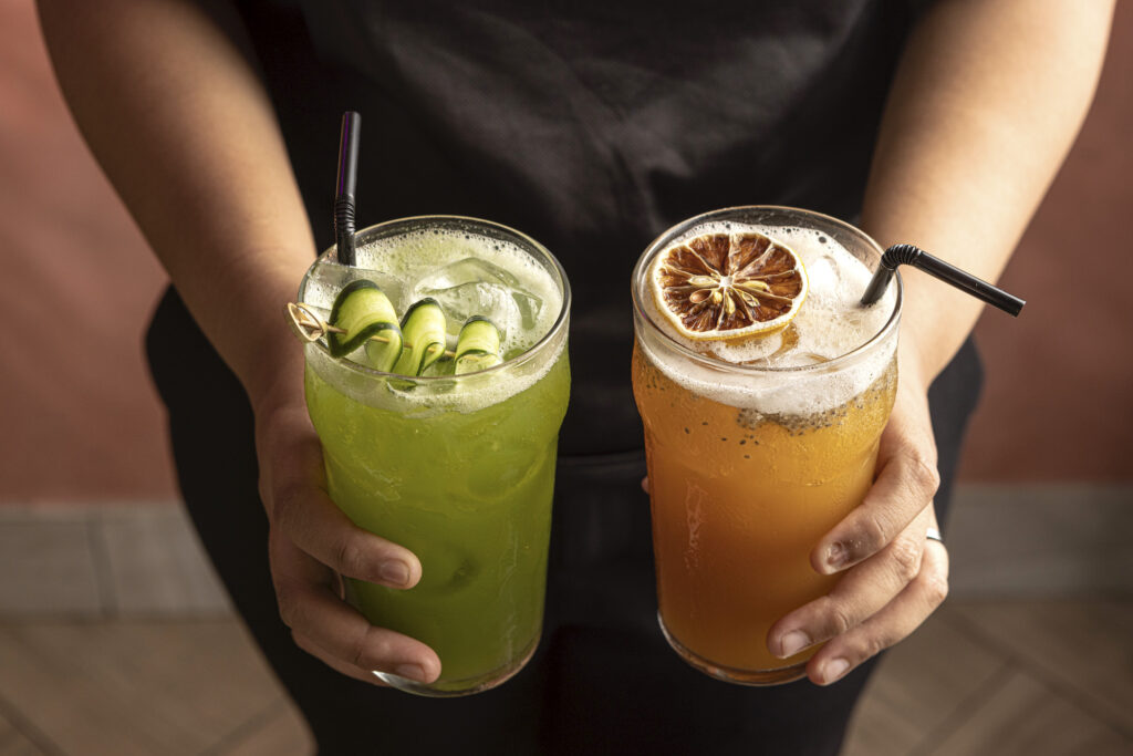 Two of Tittos' agua frescas: cucumber elderflower with lemon and Titto's iced tea, a passionfruit-infused brewed tea with chia seeds