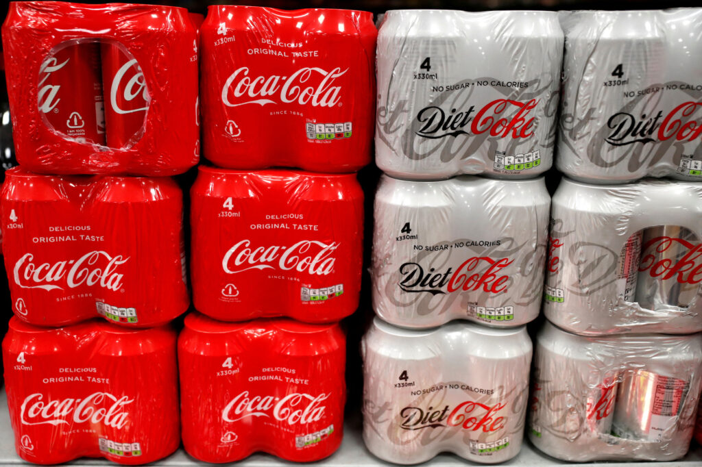 FILE PHOTO: Multi can packs of Coca Cola and Diet Coke are seen for sale in a motorway services shop, Reading