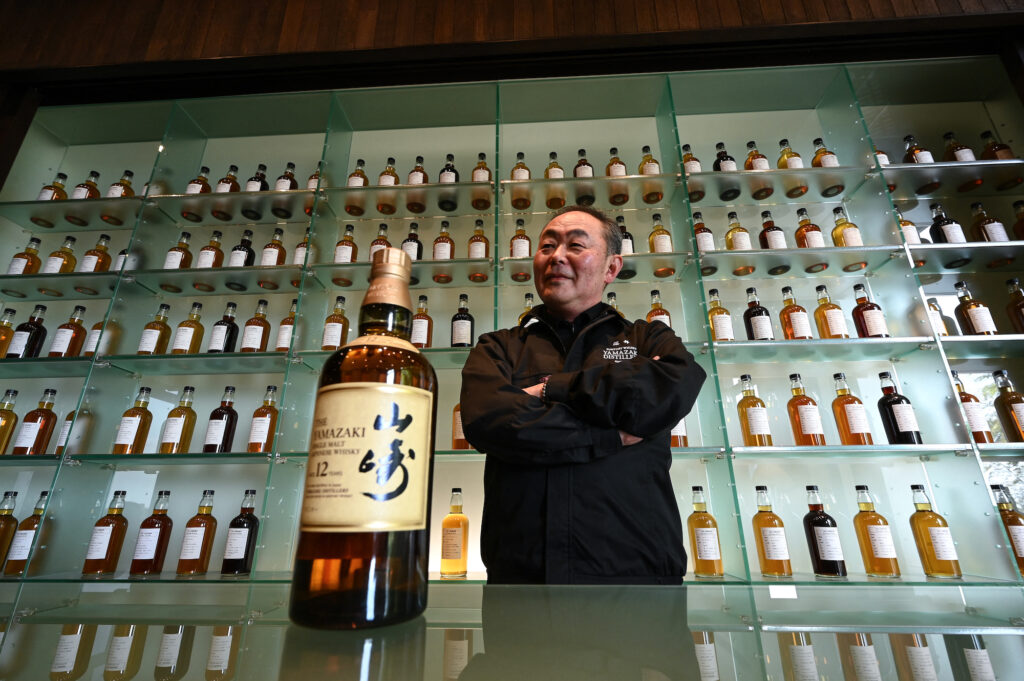 This photo taken on March 27, 2023 shows Yamazaki Distillery's senior general manager Takahisa Fujii posing as he speaks with AFP during an interview at the Suntory Yamazaki Distillery where the company's whisky is produced, in the town of Yamazaki, between Kyoto and Osaka. Japan's Yamazaki distillery marks its 100th anniversary this year with plenty to celebrate, as the country's acclaimed aged whiskys command increasingly eye-watering prices thanks to growing demand and longstanding shortages. (Photo by Richard A. Brooks / AFP) / TO GO WITH Japan-beverage-whisky-suntory, FOCUS by Natsuko FUKUE