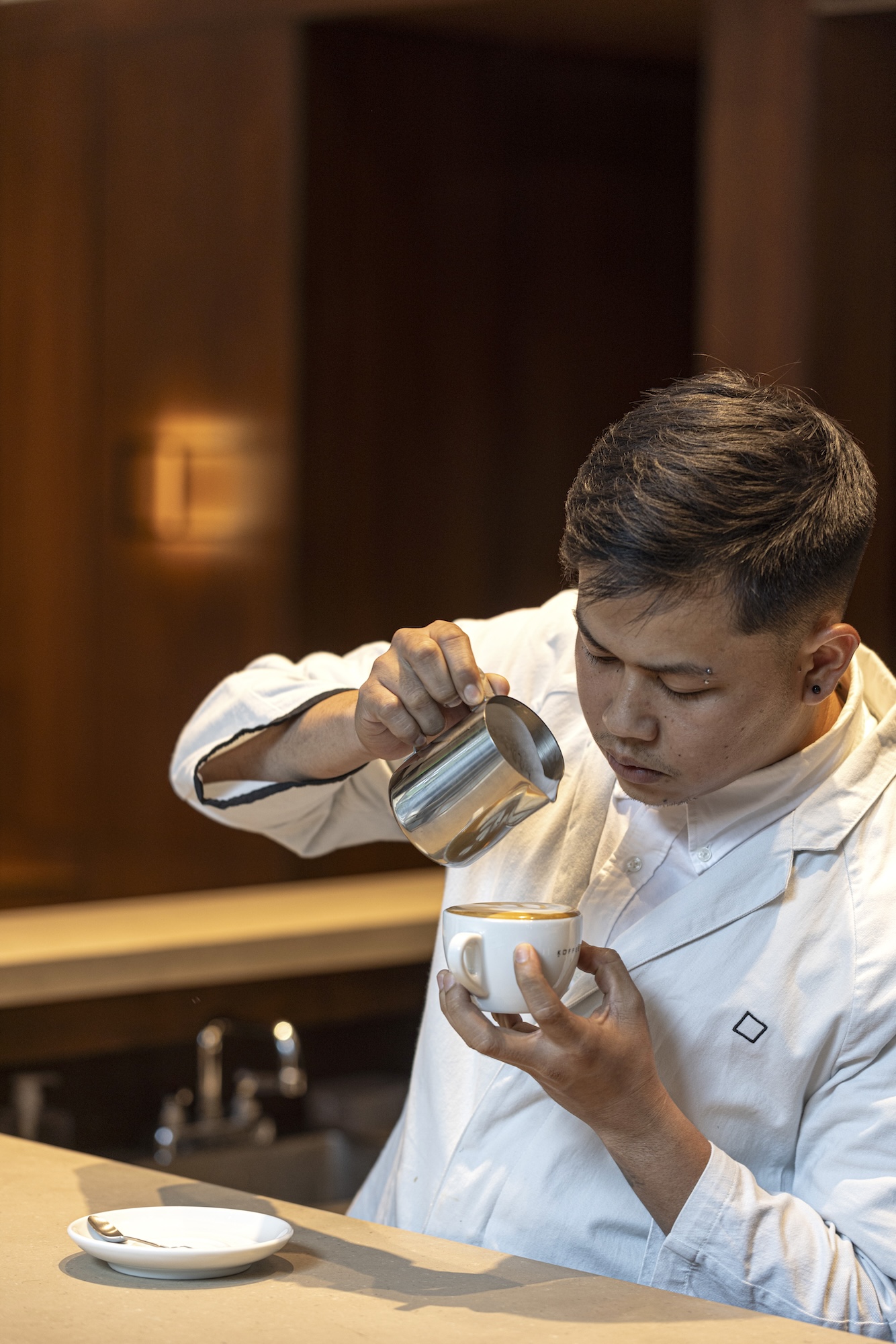 An Omotesando Koffee barista back into the grind