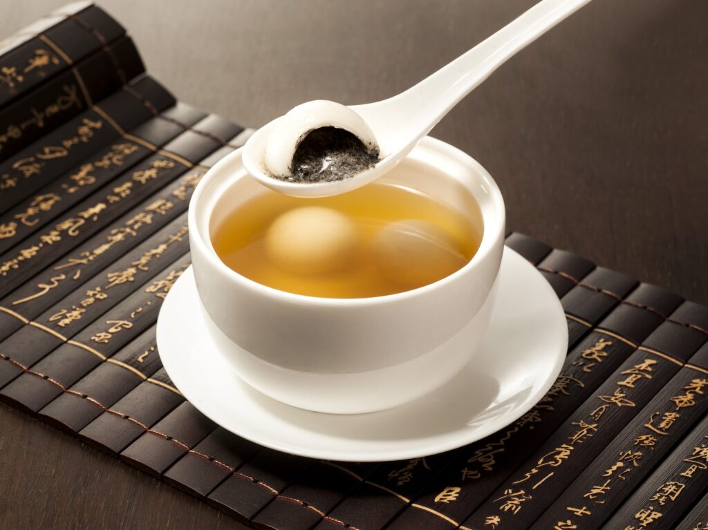 Black sesame glutinous rice ball served in ginger soup