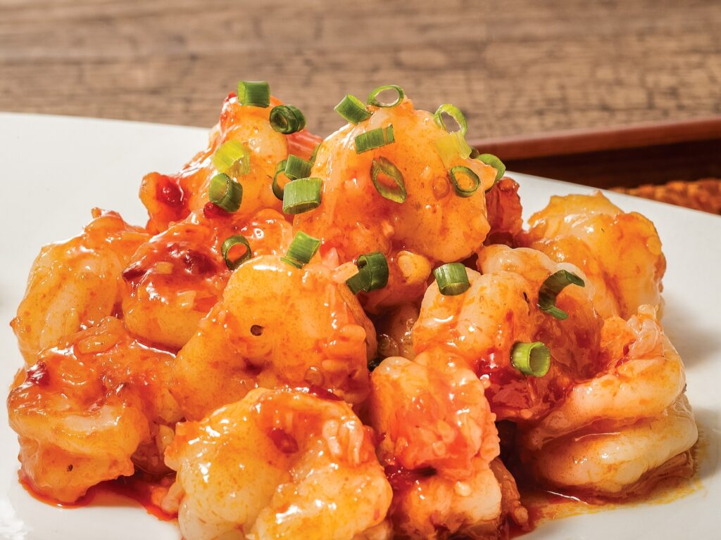 Stir-fried prawns in spicy bean and tomato sauce
